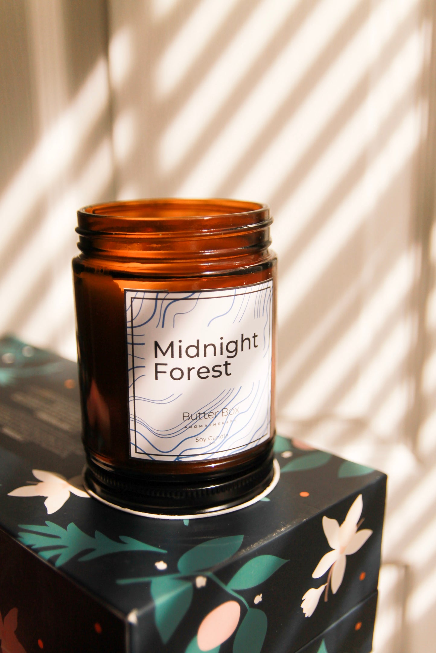 scented candle jars in an amber glass